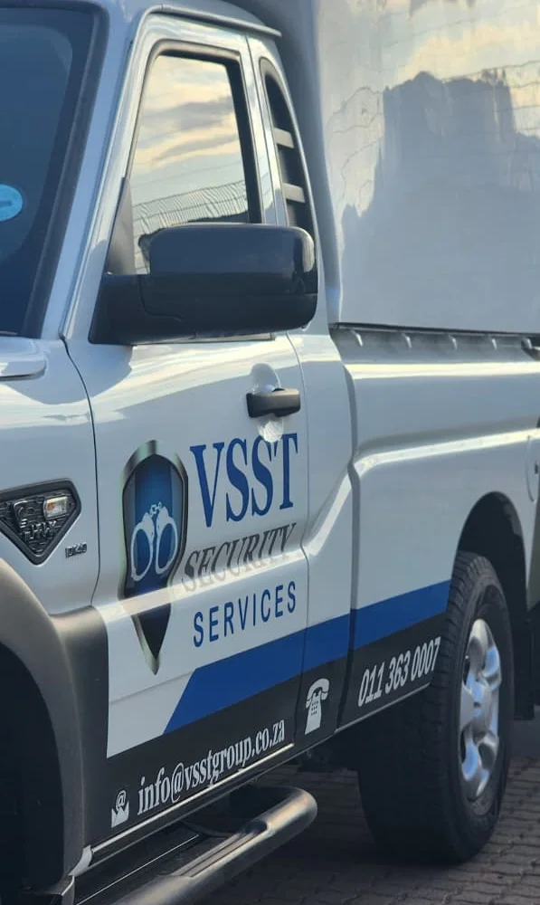 Close-up of the VSST logo and contact details on a vehicle door