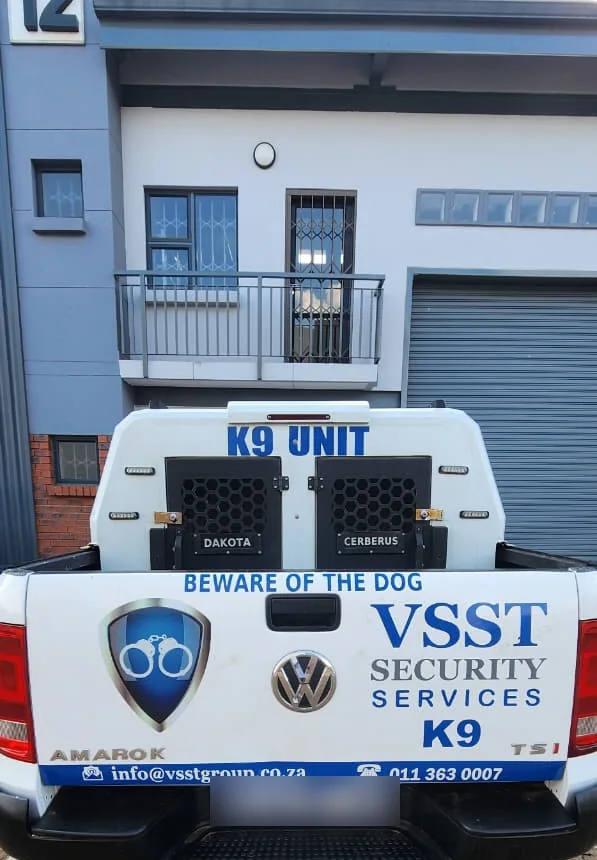 Rear of a VSST vehicle with K9 Unit branding and company contact details
