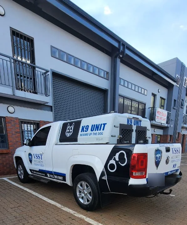 VSST-branded vehicle parked outside a business park building